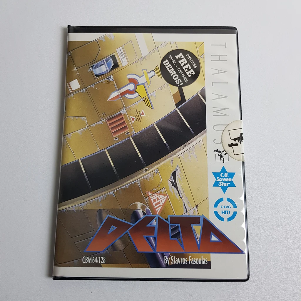 Delta videojáték borító Commodore 64-hez, Thalamus kiadásban, színes sci-fi grafikával.
