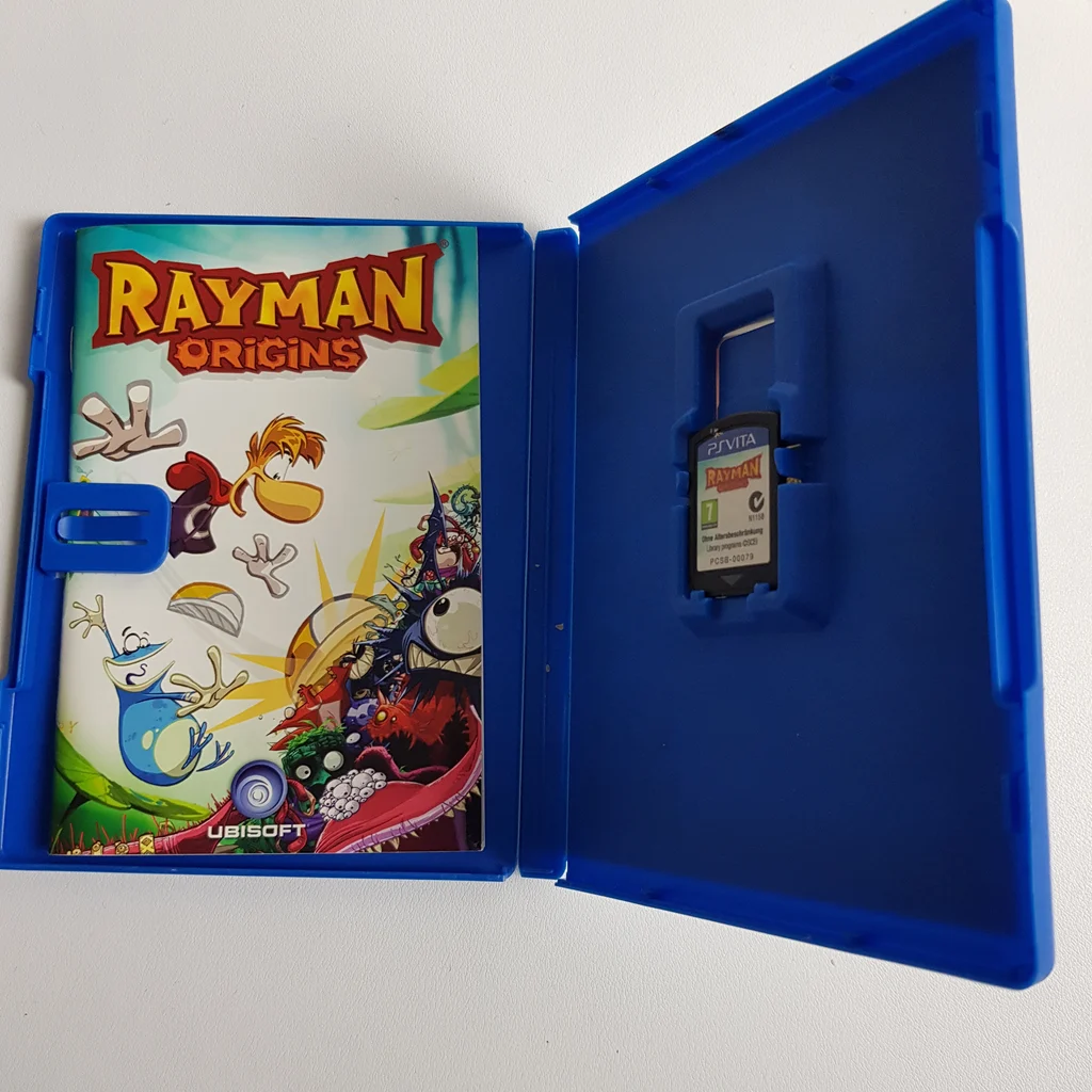 Rayman Origins PS Vita doboz és játékkártya Rayman Origins PS Vita játék nyitott doboza, benne a játékkártyával és borítóval.