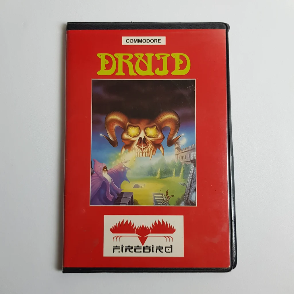 Druid videojáték borító Commodore platformra Druid videojáték doboz borítója piros háttérrel, középen fantasy illusztrációval, Commodore felirattal