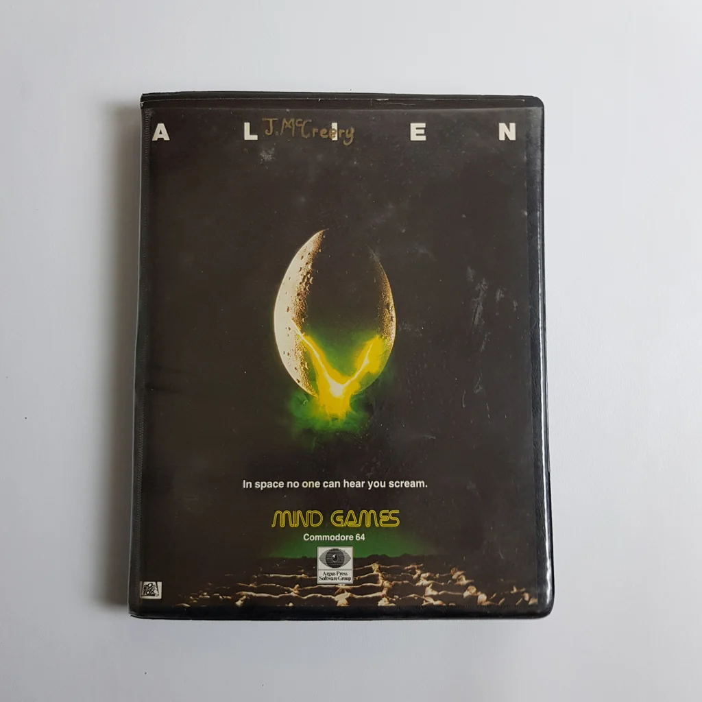 Alien Mind Games Commodore 64 játék doboz elölről Alien Mind Games videójáték doboza, Alien tojás grafikával, Commodore 64-re.